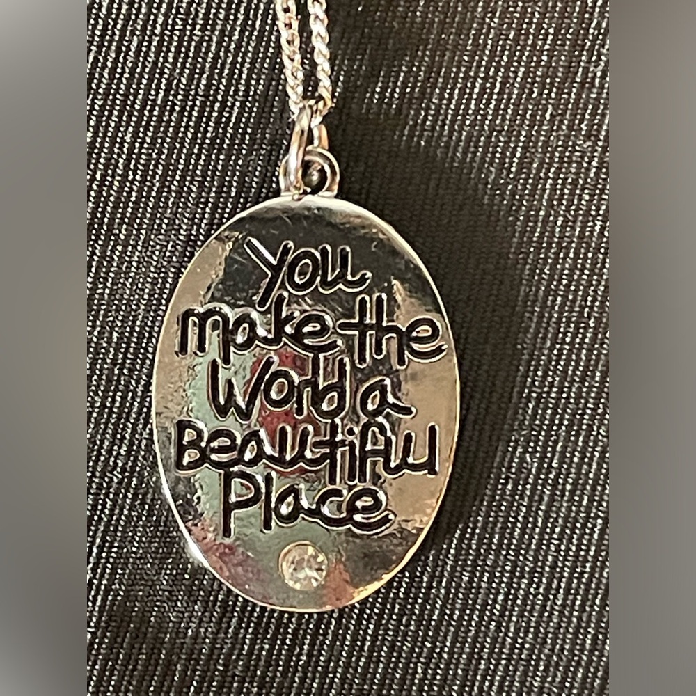 NWT Charm and necklace that says “You make the world a better place”